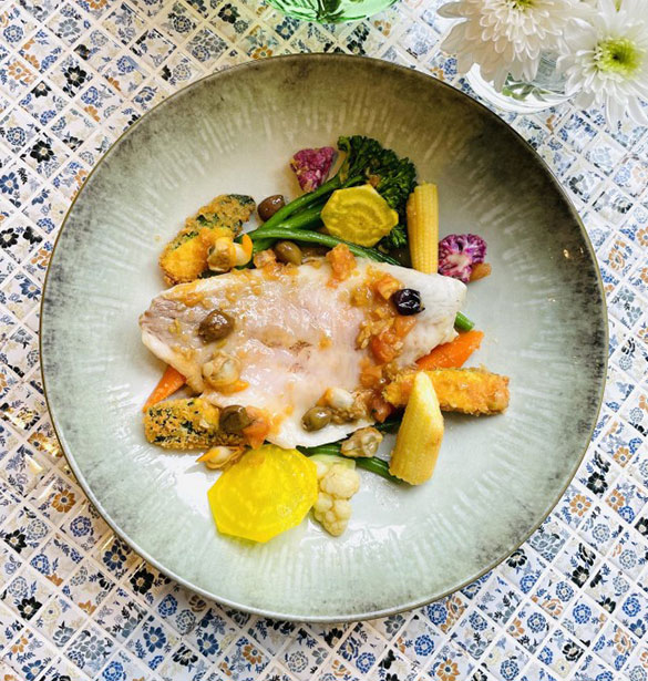 Sea bream with bouillabaisse sauce and breaded zucchini